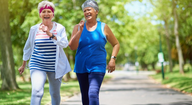 Two seniors comparing their retirement plans.